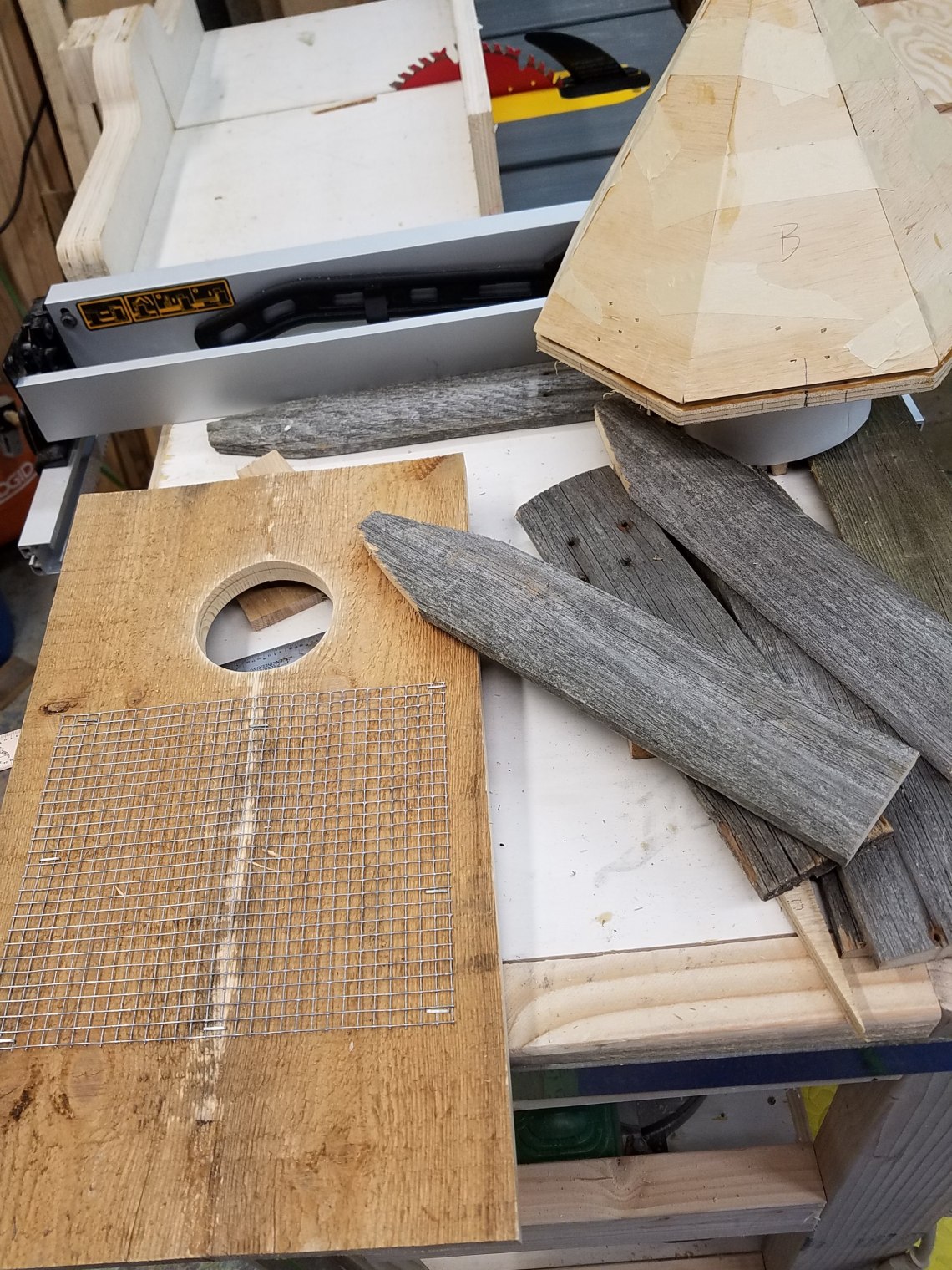 Inside front owl house panel with wire mesh for owlets